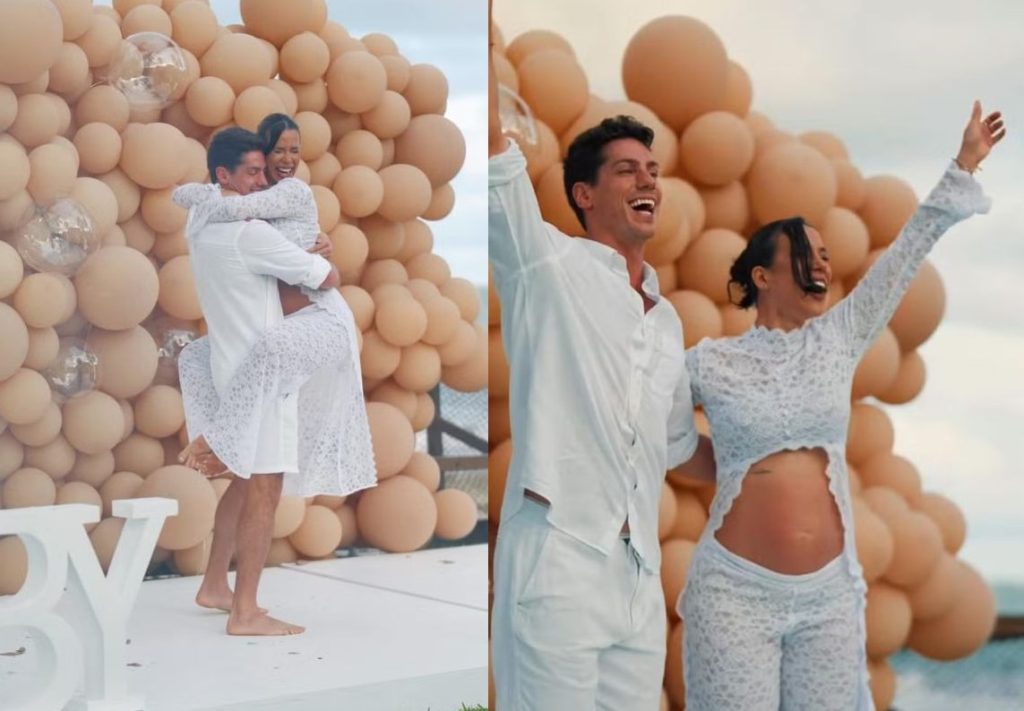 Luciano Taborda e Larissa Tomásia no chá revelação do filho deles, sorrindo e comemorando.